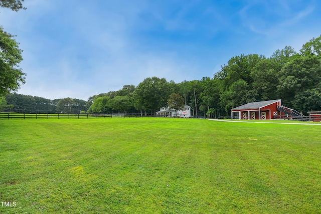 633 Fleming Rd, Youngsville, NC 27596 - view of yard featuring an outdoor structure and a view of trees
