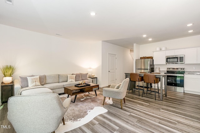 2050 Trailside Dr, Durham, NC 27704 - living area with light wood-style flooring and recessed lighting