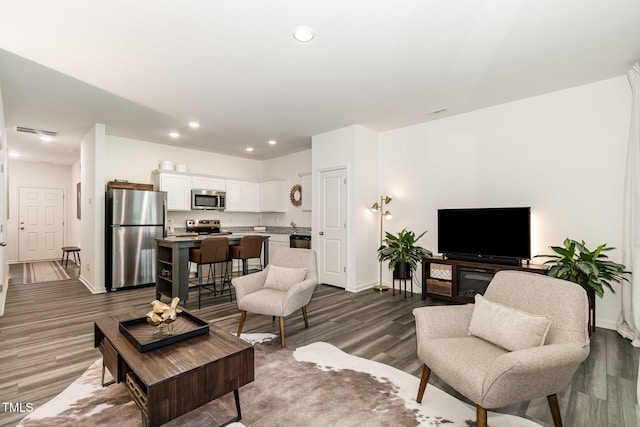 2050 Trailside Dr, Durham, NC 27704 - living room with dark wood-type flooring and recessed lighting