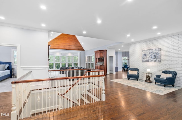 114 Kendleton Pl, Cary, NC 27518 - hall with an upstairs landing, recessed lighting, wood finished floors, and brick wall