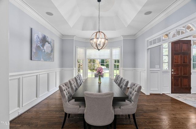 114 Kendleton Pl, Cary, NC 27518 - dining area with a tray ceiling, a chandelier, a decorative wall, dark wood finished floors, and wainscoting