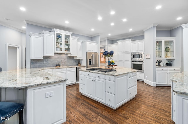 114 Kendleton Pl, Cary, NC 27518 - kitchen with stainless steel appliances, crown molding, decorative backsplash, dark wood-type flooring, and recessed lighting