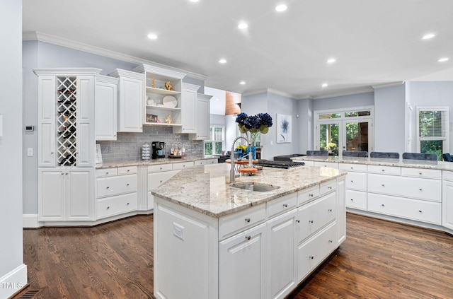 114 Kendleton Pl, Cary, NC 27518 - kitchen with a center island with sink, dark wood finished floors, ornamental molding, open shelves, and recessed lighting
