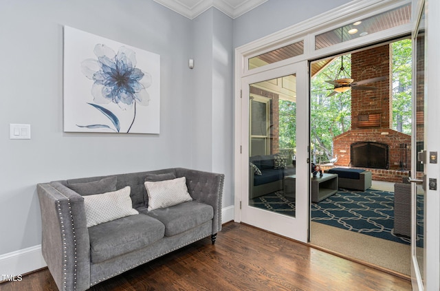 114 Kendleton Pl, Cary, NC 27518 - sitting room featuring wood finished floors, ornamental molding, and a fireplace