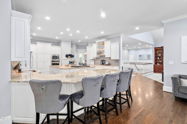 114 Kendleton Pl, Cary, NC 27518 - kitchen featuring stainless steel appliances, crown molding, open shelves, backsplash, and white cabinetry