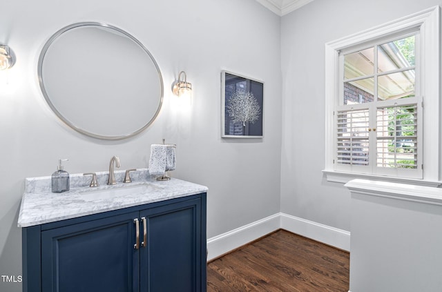 114 Kendleton Pl, Cary, NC 27518 - bathroom with wood finished floors, vanity, and ornamental molding