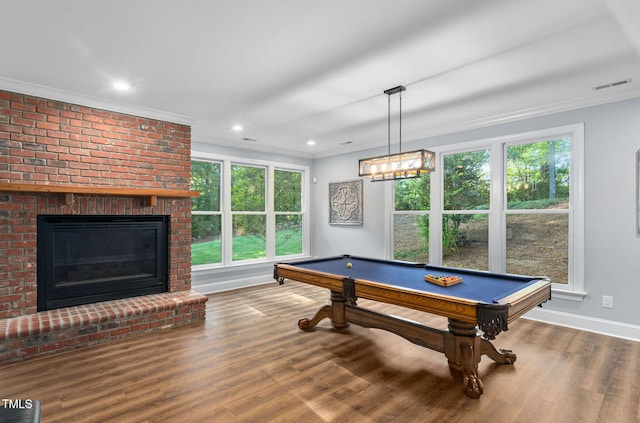 114 Kendleton Pl, Cary, NC 27518 - rec room featuring crown molding, wood finished floors, billiards, a brick fireplace, and recessed lighting