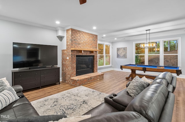 114 Kendleton Pl, Cary, NC 27518 - living area featuring wood finished floors, crown molding, billiards, recessed lighting, and a fireplace