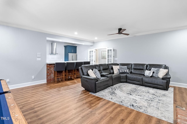 114 Kendleton Pl, Cary, NC 27518 - living area featuring ceiling fan, ornamental molding, recessed lighting, and wood finished floors
