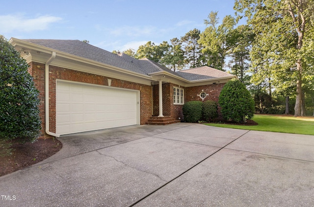 114 Kendleton Pl, Cary, NC 27518 - single story home with concrete driveway, brick siding, an attached garage, roof with shingles, and a front yard
