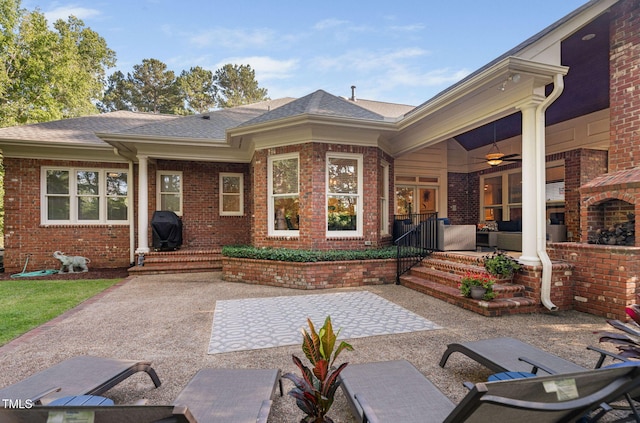 114 Kendleton Pl, Cary, NC 27518 - back of house featuring brick siding, ceiling fan, and a shingled roof