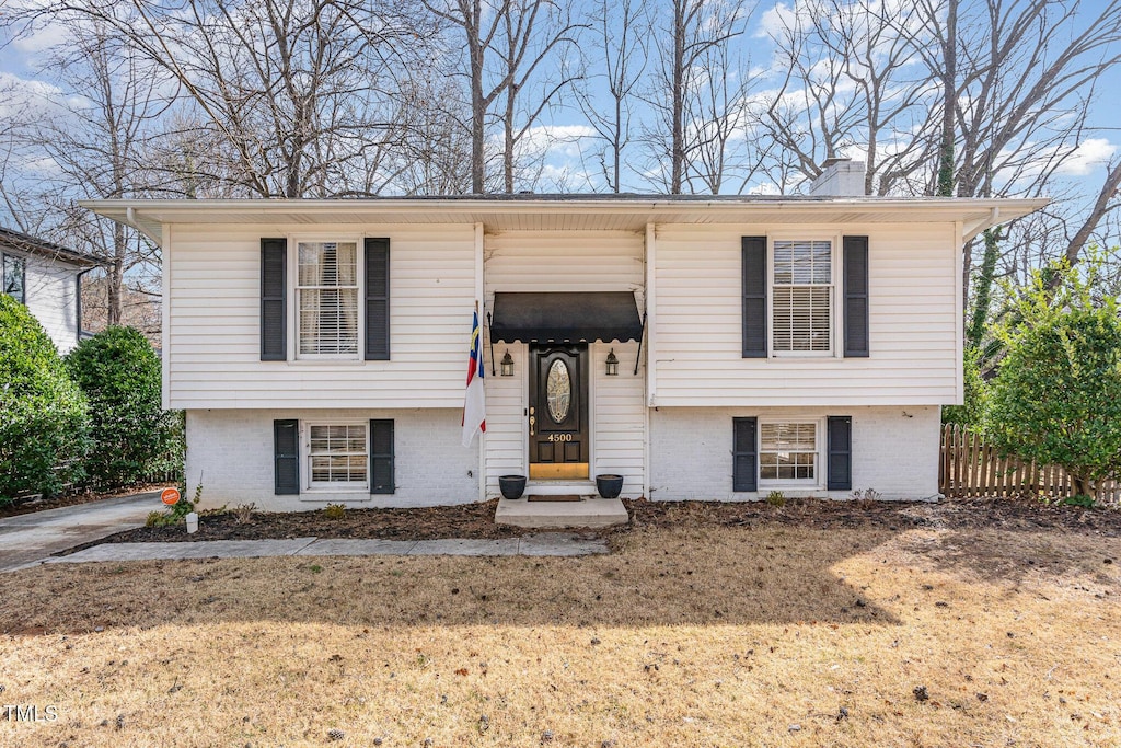4500 Latimer Rd, Raleigh, NC 27609 - raised ranch with brick siding and a chimney