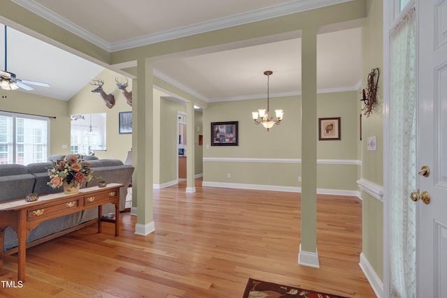 300 Williamston Ridge Dr, Youngsville, NC 27596 - living room featuring a chandelier, light wood finished floors, a ceiling fan, and crown molding
