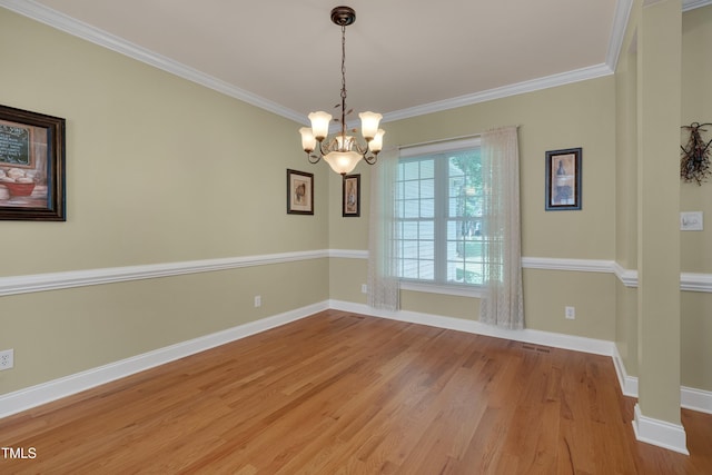 300 Williamston Ridge Dr, Youngsville, NC 27596 - unfurnished room featuring crown molding, wood finished floors, and a chandelier