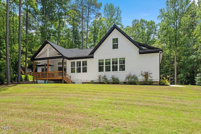 88 Priscilla Ln, Fuquay Varina, NC 27526 - rear view of property featuring crawl space, a wooden deck, and a yard
