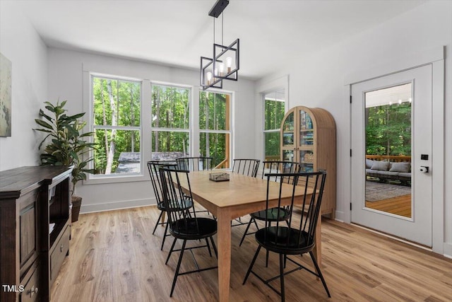 88 Priscilla Ln, Fuquay Varina, NC 27526 - dining room with plenty of natural light, light wood-style floors, and a chandelier