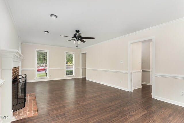 1006 Mingo Pl, Knightdale, NC 27545 - unfurnished living room featuring a ceiling fan, crown molding, dark wood-style floors, and a brick fireplace