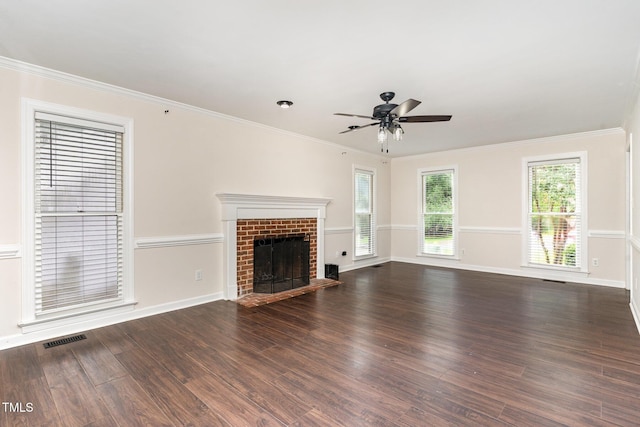 1006 Mingo Pl, Knightdale, NC 27545 - unfurnished living room with ceiling fan, wood finished floors, a fireplace, and crown molding