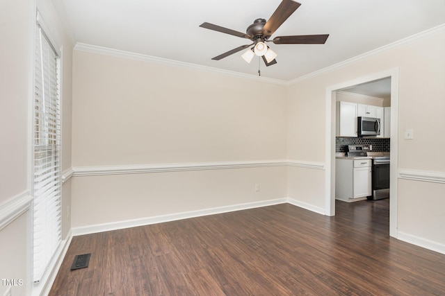 1006 Mingo Pl, Knightdale, NC 27545 - empty room with dark wood-style flooring, a ceiling fan, and ornamental molding