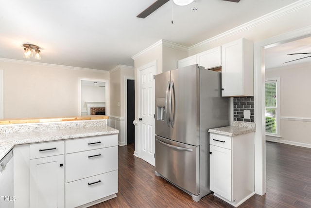 1006 Mingo Pl, Knightdale, NC 27545 - kitchen with stainless steel fridge with ice dispenser, ceiling fan, a fireplace, white cabinets, and dark wood-style flooring