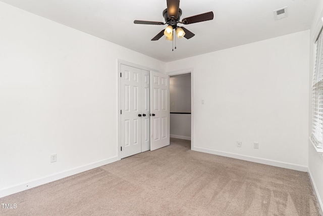 1006 Mingo Pl, Knightdale, NC 27545 - unfurnished bedroom featuring carpet floors, a ceiling fan, and a closet