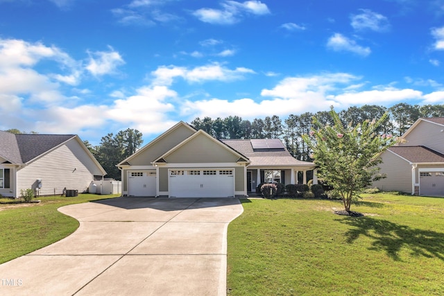 39 All Aboard Cir, Willow Springs, NC 27592 - view of front of house with driveway, solar panels, an attached garage, and a front yard