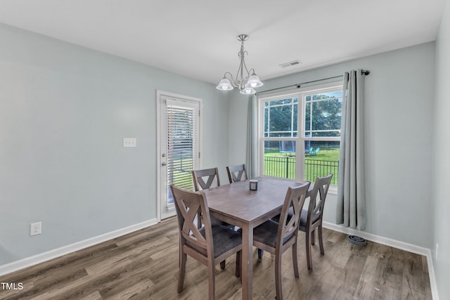 39 All Aboard Cir, Willow Springs, NC 27592 - dining room featuring a chandelier, wood finished floors, and plenty of natural light