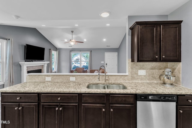 39 All Aboard Cir, Willow Springs, NC 27592 - kitchen featuring dishwasher, vaulted ceiling, a ceiling fan, open floor plan, and dark brown cabinets