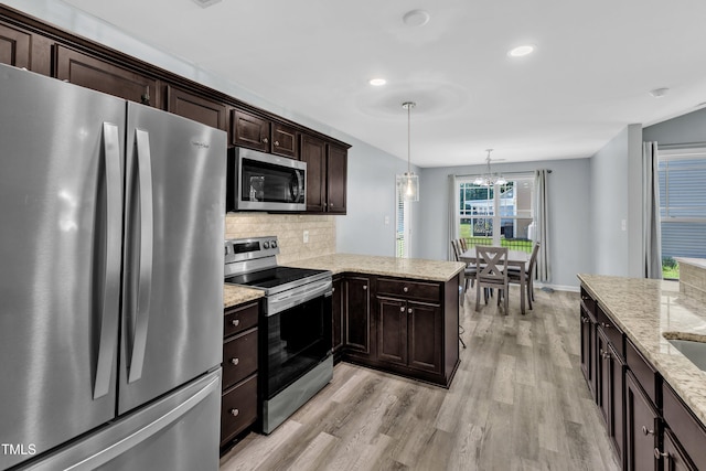 39 All Aboard Cir, Willow Springs, NC 27592 - kitchen featuring appliances with stainless steel finishes, light wood-style flooring, a chandelier, tasteful backsplash, and dark brown cabinetry