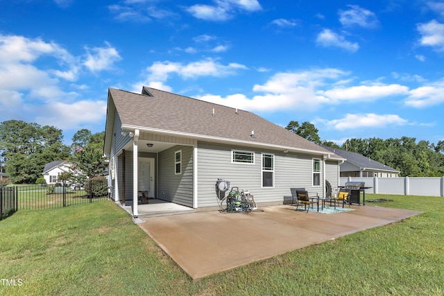 39 All Aboard Cir, Willow Springs, NC 27592 - back of property featuring a patio area, a fenced backyard, and a shingled roof
