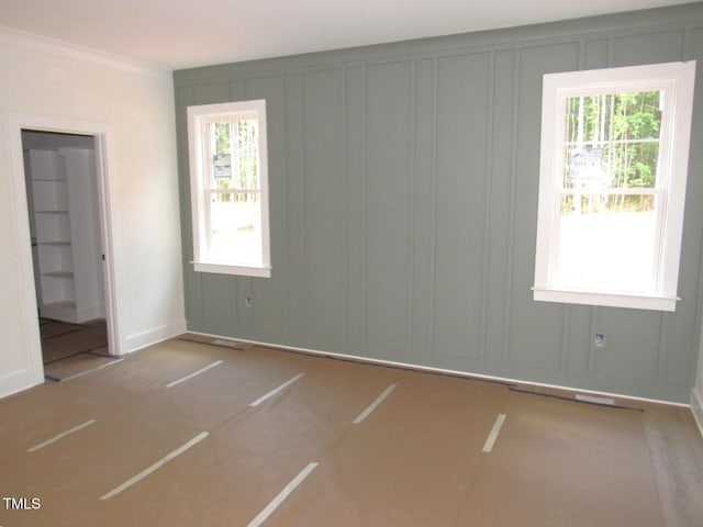 1155 Shonele Ln, Stem, NC 27581 - unfurnished bedroom with a decorative wall, multiple windows, and crown molding