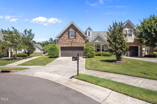 5216 Marcella Ct, Durham, NC 27707 - traditional-style house featuring stone siding, a garage, concrete driveway, and a front lawn