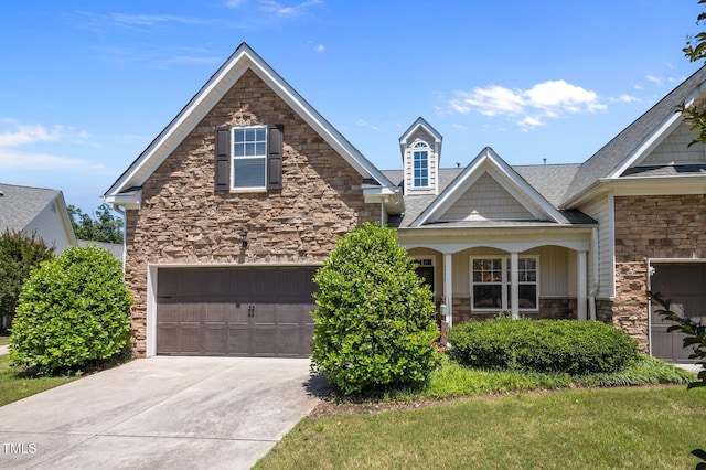 5216 Marcella Ct, Durham, NC 27707 - craftsman inspired home with stone siding, a garage, and driveway