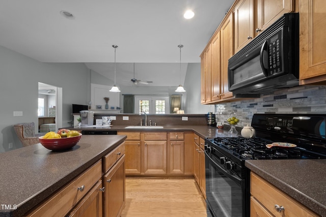 5216 Marcella Ct, Durham, NC 27707 - kitchen featuring black appliances, tasteful backsplash, dark countertops, a ceiling fan, and pendant lighting