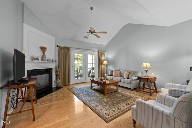 5216 Marcella Ct, Durham, NC 27707 - living area featuring a ceiling fan, a fireplace with flush hearth, wood finished floors, and high vaulted ceiling