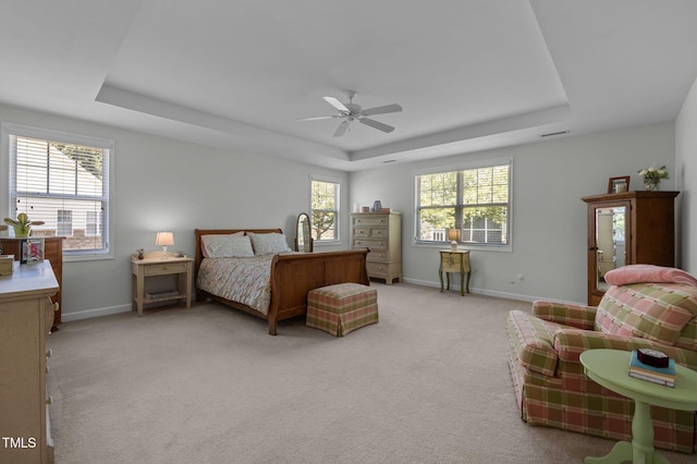 5216 Marcella Ct, Durham, NC 27707 - bedroom featuring a raised ceiling, light carpet, and a ceiling fan