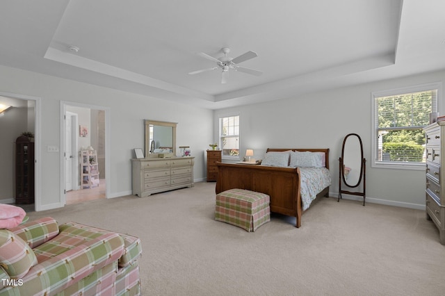5216 Marcella Ct, Durham, NC 27707 - bedroom with a tray ceiling, light colored carpet, and ceiling fan