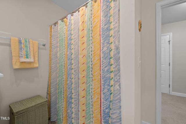 5216 Marcella Ct, Durham, NC 27707 - full bathroom featuring baseboards and curtained shower