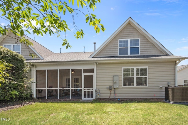 5216 Marcella Ct, Durham, NC 27707 - rear view of house featuring a yard and a shingled roof