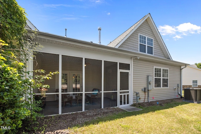 5216 Marcella Ct, Durham, NC 27707 - back of house with a sunroom and a yard