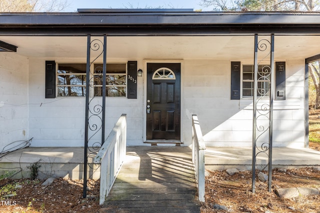 3013 Avery St, Raleigh, NC 27610 - entrance to property featuring covered porch and concrete block siding