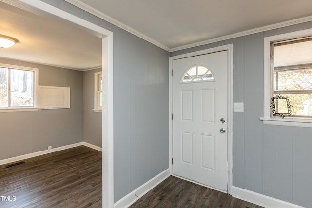 3013 Avery St, Raleigh, NC 27610 - foyer entrance with dark wood-type flooring and ornamental molding