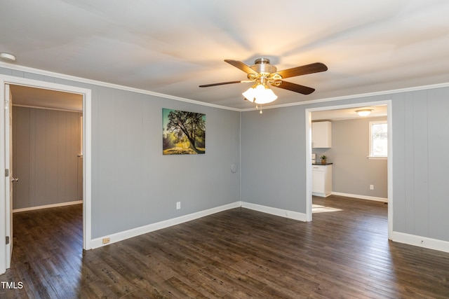 3013 Avery St, Raleigh, NC 27610 - spare room featuring ornamental molding, ceiling fan, and dark wood-style flooring