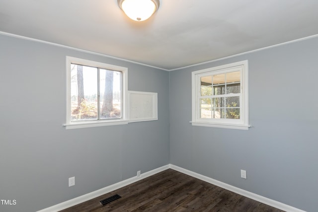 3013 Avery St, Raleigh, NC 27610 - spare room featuring ornamental molding and dark wood-style floors