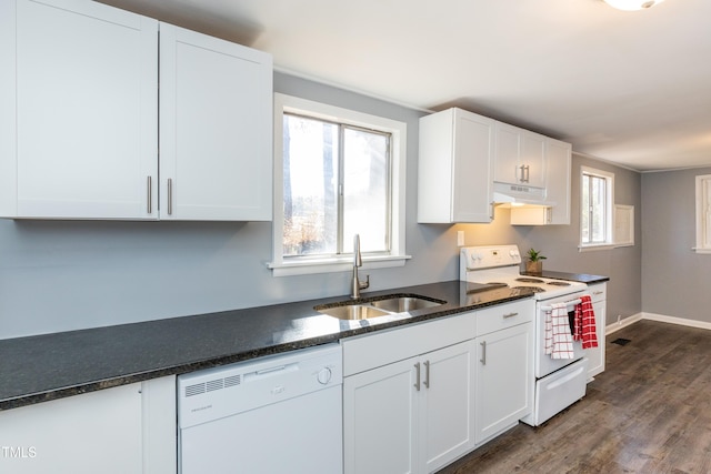3013 Avery St, Raleigh, NC 27610 - kitchen featuring white appliances, under cabinet range hood, white cabinets, dark wood-style flooring, and dark stone countertops
