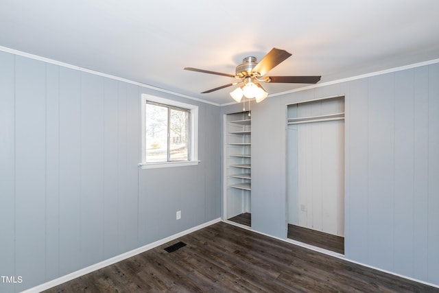 3013 Avery St, Raleigh, NC 27610 - unfurnished bedroom featuring dark wood finished floors, a closet, crown molding, and a ceiling fan