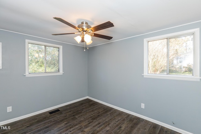 3013 Avery St, Raleigh, NC 27610 - empty room with ceiling fan and dark wood-style floors