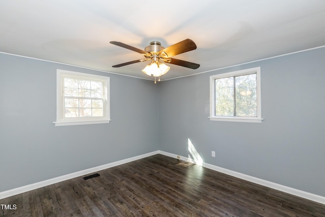 3013 Avery St, Raleigh, NC 27610 - spare room featuring dark wood-style flooring and a ceiling fan