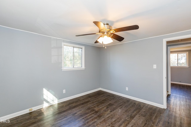 3013 Avery St, Raleigh, NC 27610 - empty room with ceiling fan and dark wood-style flooring