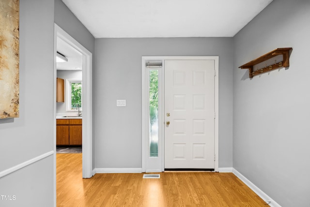 113 Twisted Oak Pl, Durham, NC 27705 - entryway featuring light wood-type flooring and baseboards
